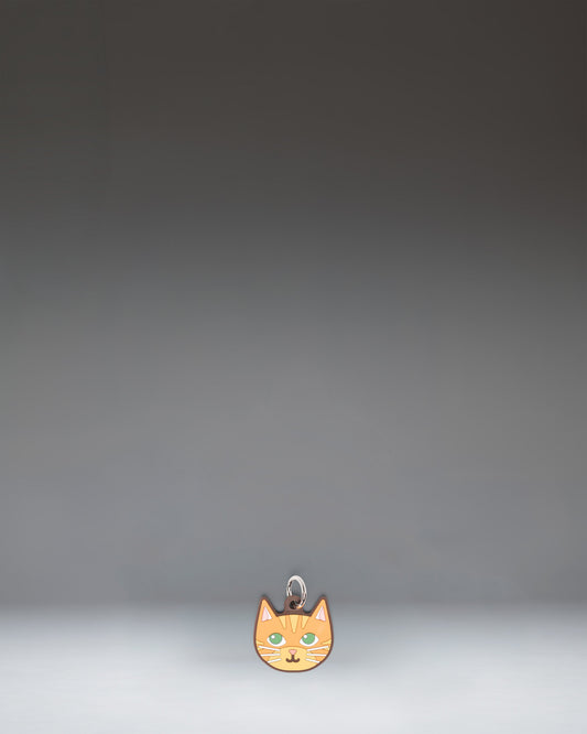 Herschel Cat Bag Charm in Orange Cat colorway, featuring a stylized orange cat design.
