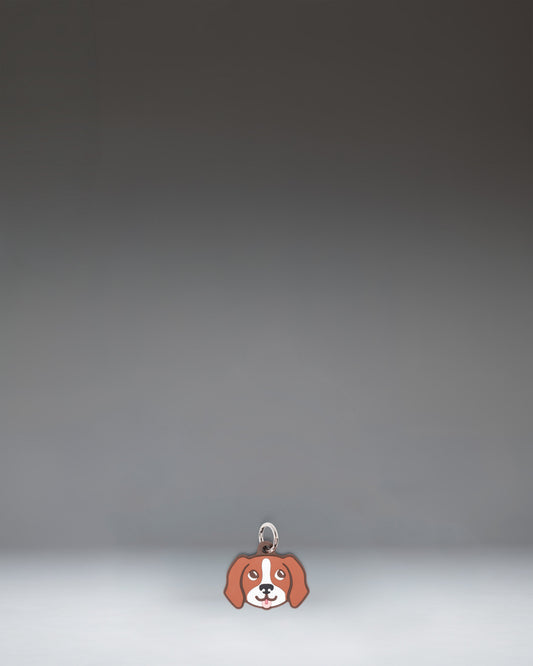 Herschel Dog Bag Charm in Brown Dog, a small plush dog accessory designed as a stylish bag charm.