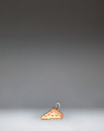 Herschel Pizza Bag Charm in Pepperoni colorway, styled like a slice of pepperoni pizza.