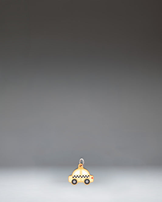 Herschel Taxi Bag Charm in Taxi, a yellow checker-cab-inspired miniature bag accessory with black and white checkered details.